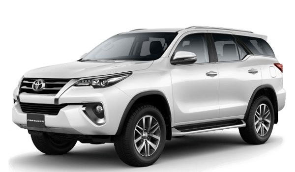 A front-side angle view of a white Toyota Fortuner SUV, showcasing its modern design and robust build.