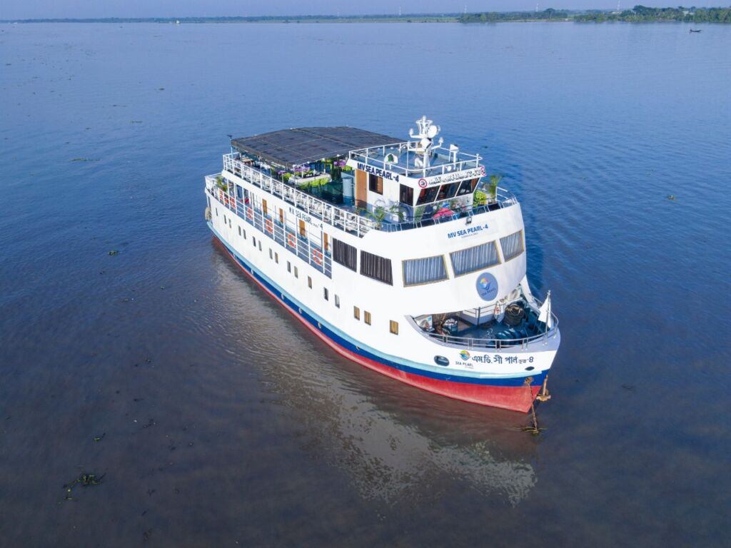 A large white and blue cruise ship called 